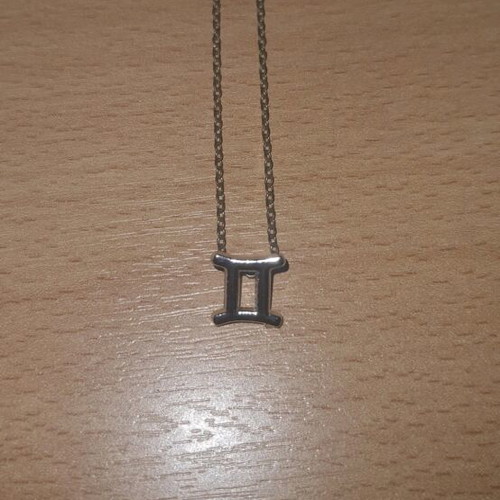 Necklace with Gemini zodiac like new, silver