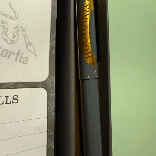 Harry Potter stationery set with pen, weekly planners, post-its, and lightning bolt clips