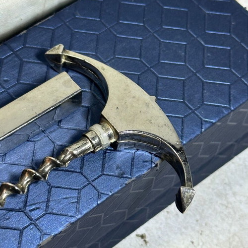 Vintage bottle opener and corkscrew anchor design used