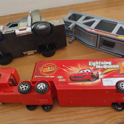 Toy Trucks pack of 3 used, including Cars-themed red truck