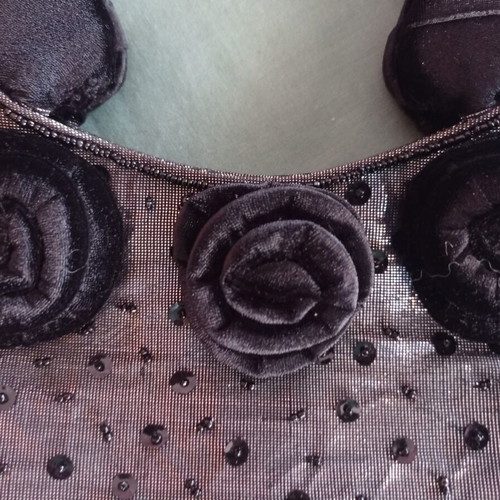 Women's handbag new with metallic silver-gray base and black velvet rosettes