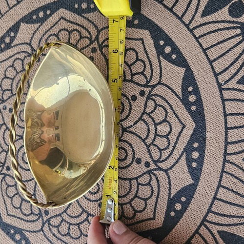 Brass decorative bowl with handle