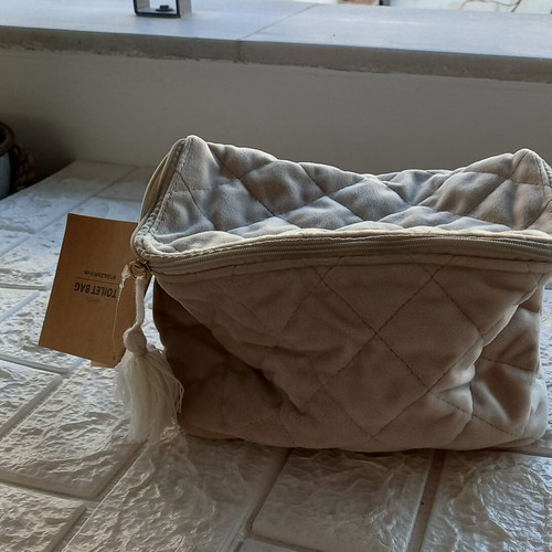 Toiletry bag new, beige synthetic velvet fabric