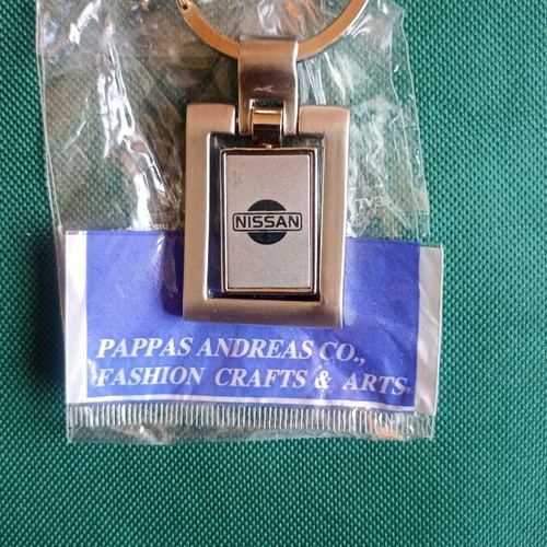 Vintage Nissan spinning keychain, New Old Stock, heavy metal 38g