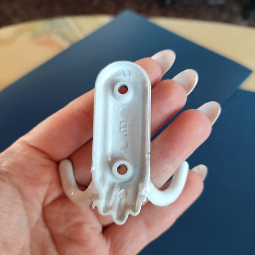 Small white metal hook like new