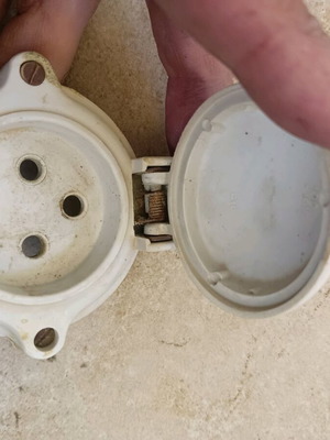 Old socket frame used with spring-loaded reset cover