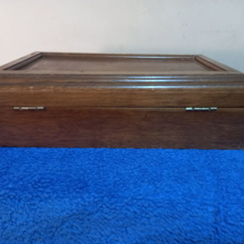 Wooden jewelry box used with velvet-lined compartments