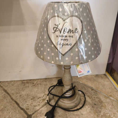 Table lamp with wooden base and green polka dot shade