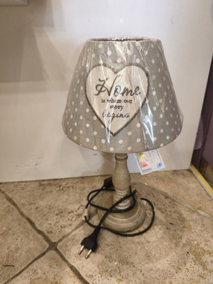 Table lamp with wooden base and green polka dot shade