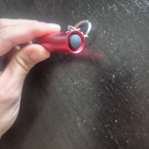 Mini LED flashlight keychain with bottle opener like new, red
