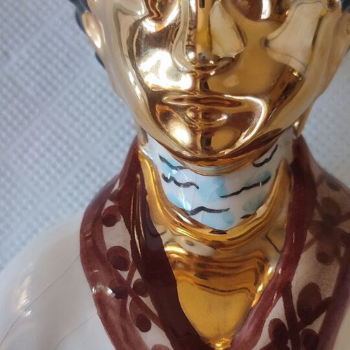 Vintage porcelain Buddha statue with gold details
