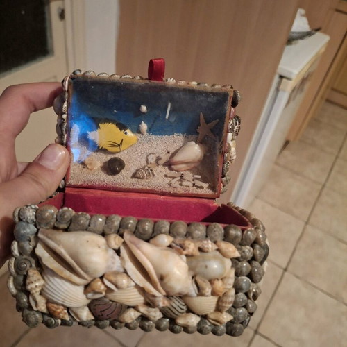 Vintage jewelry box made of shells used with minor damage