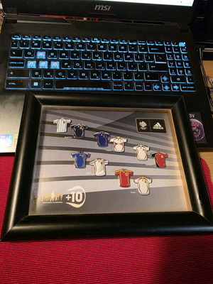 Set of collectible pins with Adidas jerseys like new