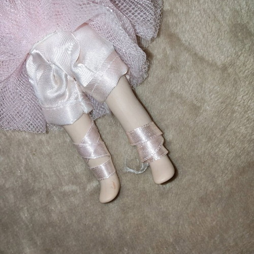 Porcelain doll like new, height 14.5 cm