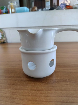 Ceramic fondue with candle base and handled bowl like new