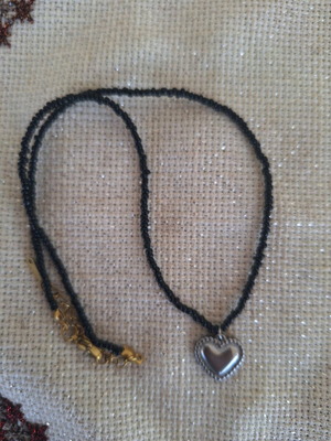 Short necklace like new with black glass beads and heart pendant