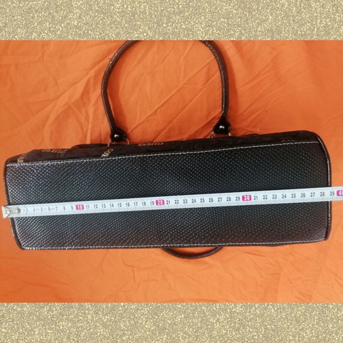 Guess vintage black handheld bag used with silver and gold details