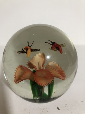 Handblown glass dome paperweight with stylized bees