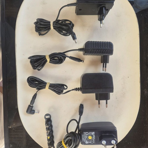 Adjustable power chargers with various plugs for electronics and laptops