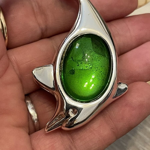 Christofle dolphin brooch with green stone