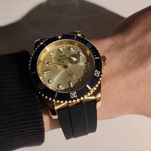 Slazenger wristwatch with black silicone strap and gold dial like new