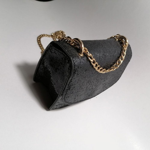 Handbag used, black glossy with gold chain