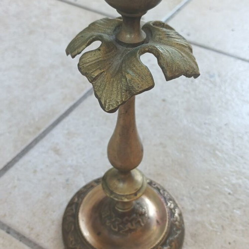 Metal candlestick used, gold color with brass finish