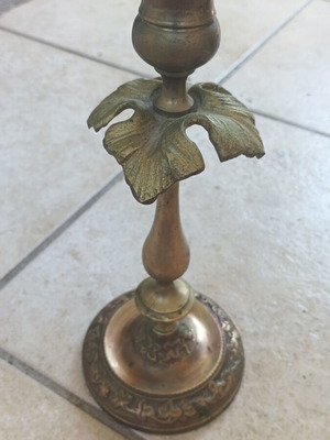 Metal candlestick used, gold color with brass finish