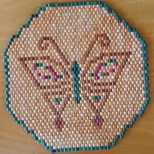Wooden placemats like new with green and red designs