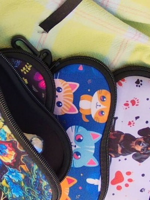 Waterproof glasses case with colorful cat, dog, butterfly, and flower designs