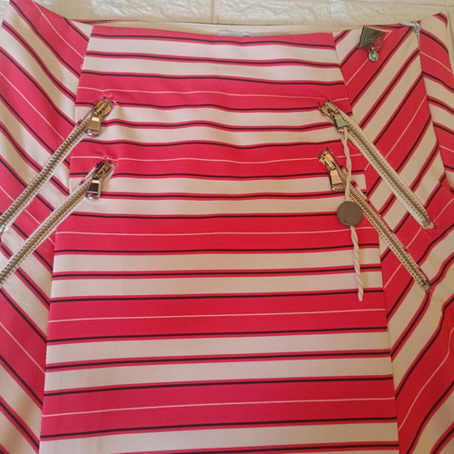 Relish skirt size 42 like new, orange with decorative zippers