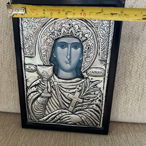 Religious icon used with metal overlay on wooden base