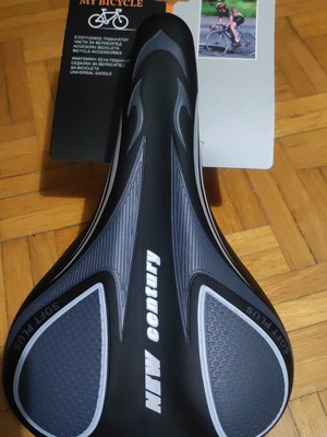 Bicycle saddle new, soft with rear reflector and adjustable front