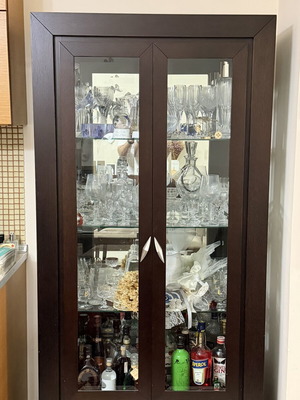 Living room display cabinet with glass doors like new, dark wood