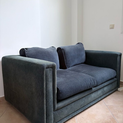 Two dark blue used two-seater sofas set