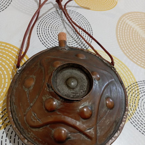 Traditional copper flask used with leather strap
