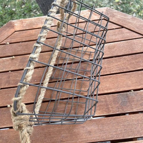 Boho style decorative basket with natural rope handles