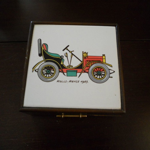 Wooden box used with car illustration on ceramic tile
