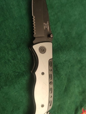 Herbertz knife used with serrated 420 steel blade and aluminum handle