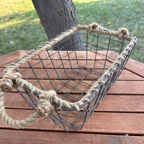 Boho style decorative basket with natural rope handles