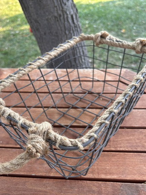 Boho style decorative basket with natural rope handles