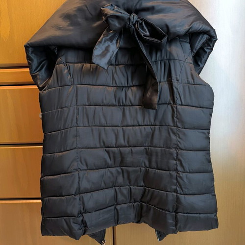 Black sleeveless Spell jacket size medium like new with bow at back