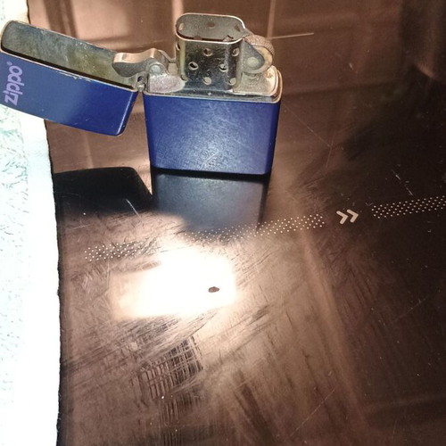 Zippo lighter used blue with purple logo