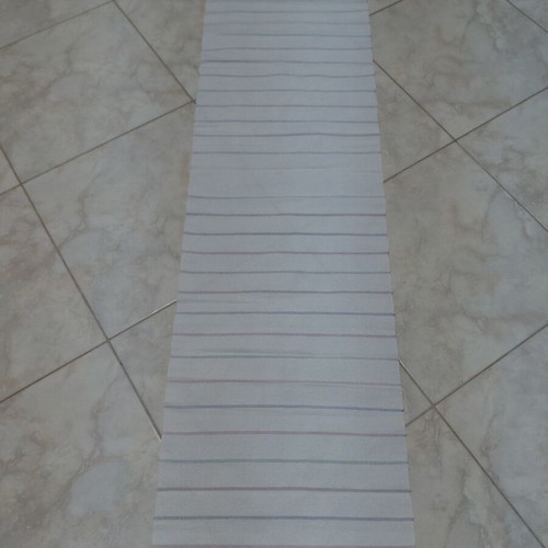 Traditional cotton fabric on loom, new, white with colorful stripes