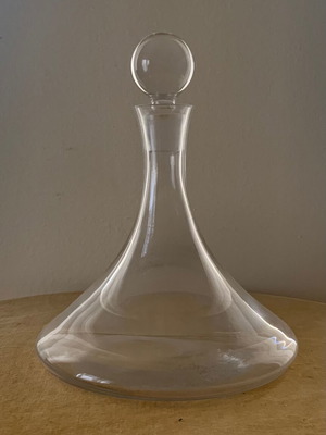 Decorative glass bottle used with small chip on stopper