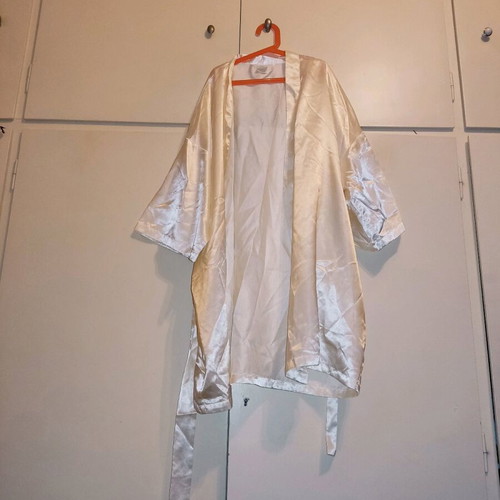 2 women's robes like new, one cream and one black with flower detail