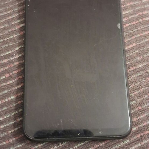 Xiaomi 9 smartphone with screen protector and case, gray
