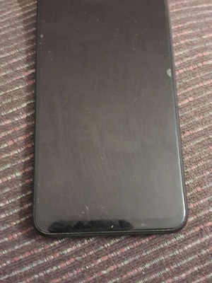 Xiaomi 9 smartphone with screen protector and case, gray