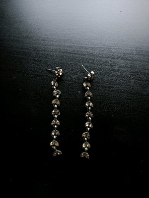 Earrings used with orange stones and boho leaf design