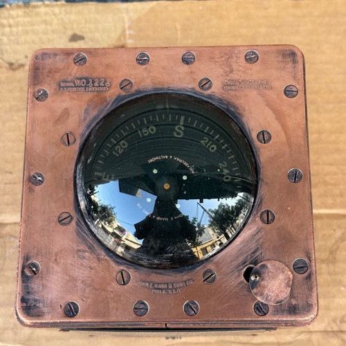 Old copper submarine compass used with artificial horizon